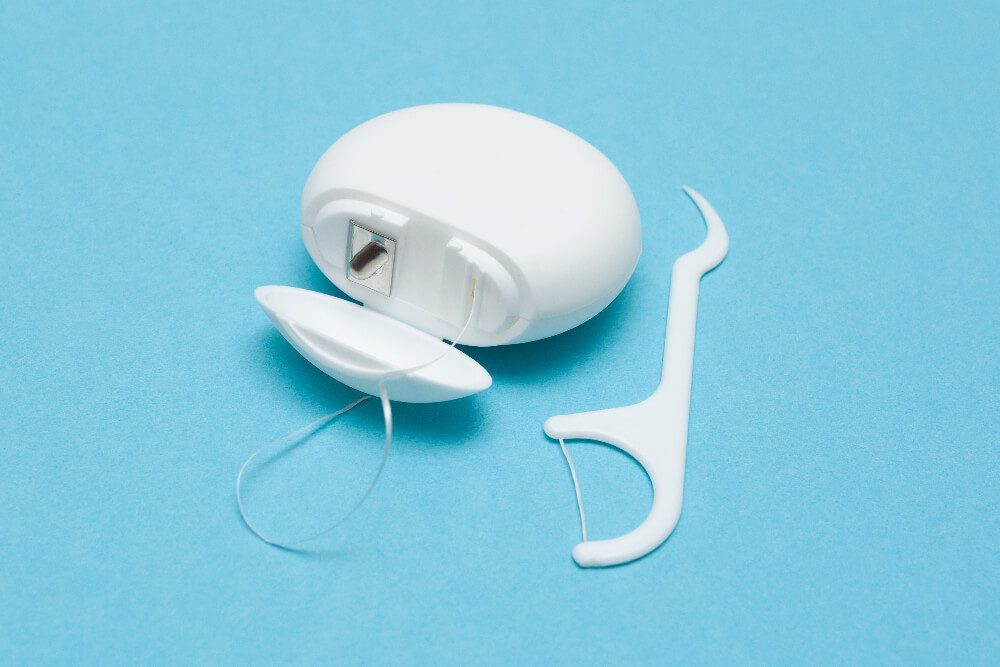 how to floss your teeth properly for better dental health